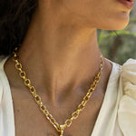 Rue gold butterfly pendant necklace with Glass Peridot and Labradorite worn by model — Mountain & Moon Chateau Soleil collection