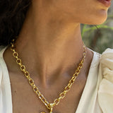 Rue gold butterfly pendant necklace with Glass Peridot and Labradorite worn by model — Mountain & Moon Chateau Soleil collection