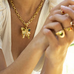 Rue butterfly pendant necklace styled on model, Glass Peridot and Labradorite in gold — Mountain & Moon jewellery