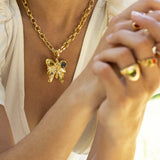 Rue butterfly pendant necklace styled on model, Glass Peridot and Labradorite in gold — Mountain & Moon jewellery