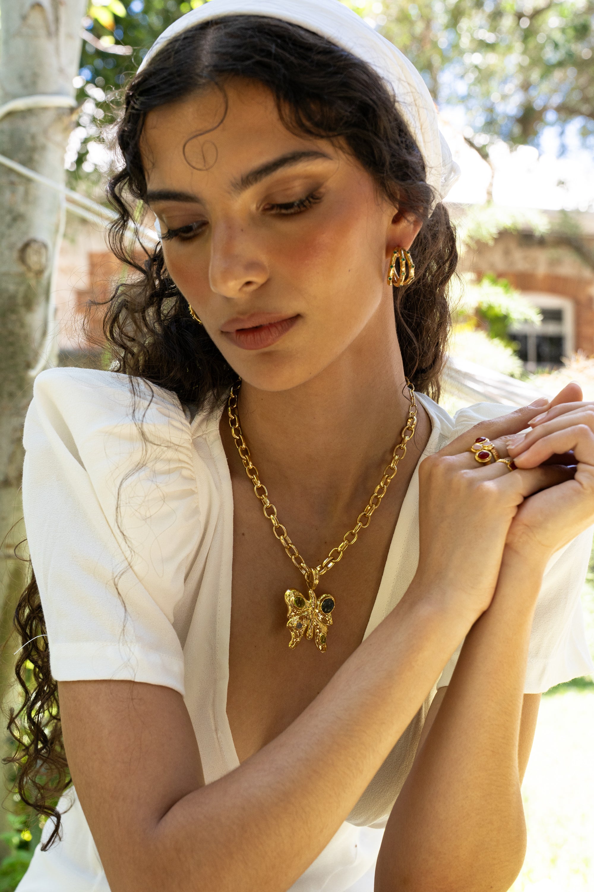 Gold butterfly pendant necklace featuring Glass Peridot and Labradorite, the Rue style — Mountain & Moon Chateau Soleil