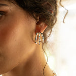 Alba silver ridged huggie hoop earrings with Blue CZ worn by model — Mountain & Moon Chateau Soleil collection