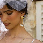 Liberty long dangle earrings styled on model, Rainbow Moonstone and Glass Pearl in gold — Mountain & Moon jewellery