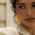 Salma gold sculptural teardrop stud earrings worn by model — Mountain & Moon Chateau Soleil collection