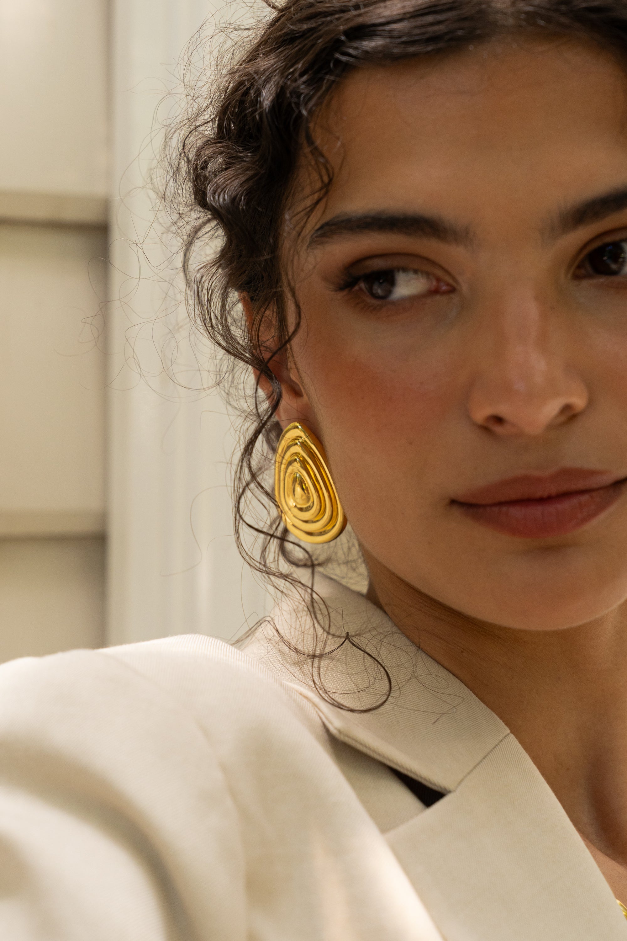 Salma gold sculptural teardrop stud earrings worn by model — Mountain & Moon Chateau Soleil collection