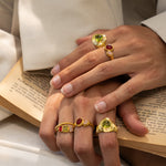 Lumi stacking ring styled on model, Glass Peridot and natural Peridot in gold — Mountain & Moon jewellery