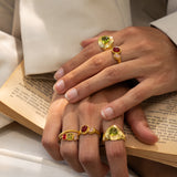 Lumi stacking ring styled on model, Glass Peridot and natural Peridot in gold — Mountain & Moon jewellery