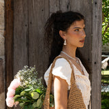 Artemis hammered huggie hoop earrings styled on model, Dalmatian Jasper in silver — Mountain & Moon jewellery