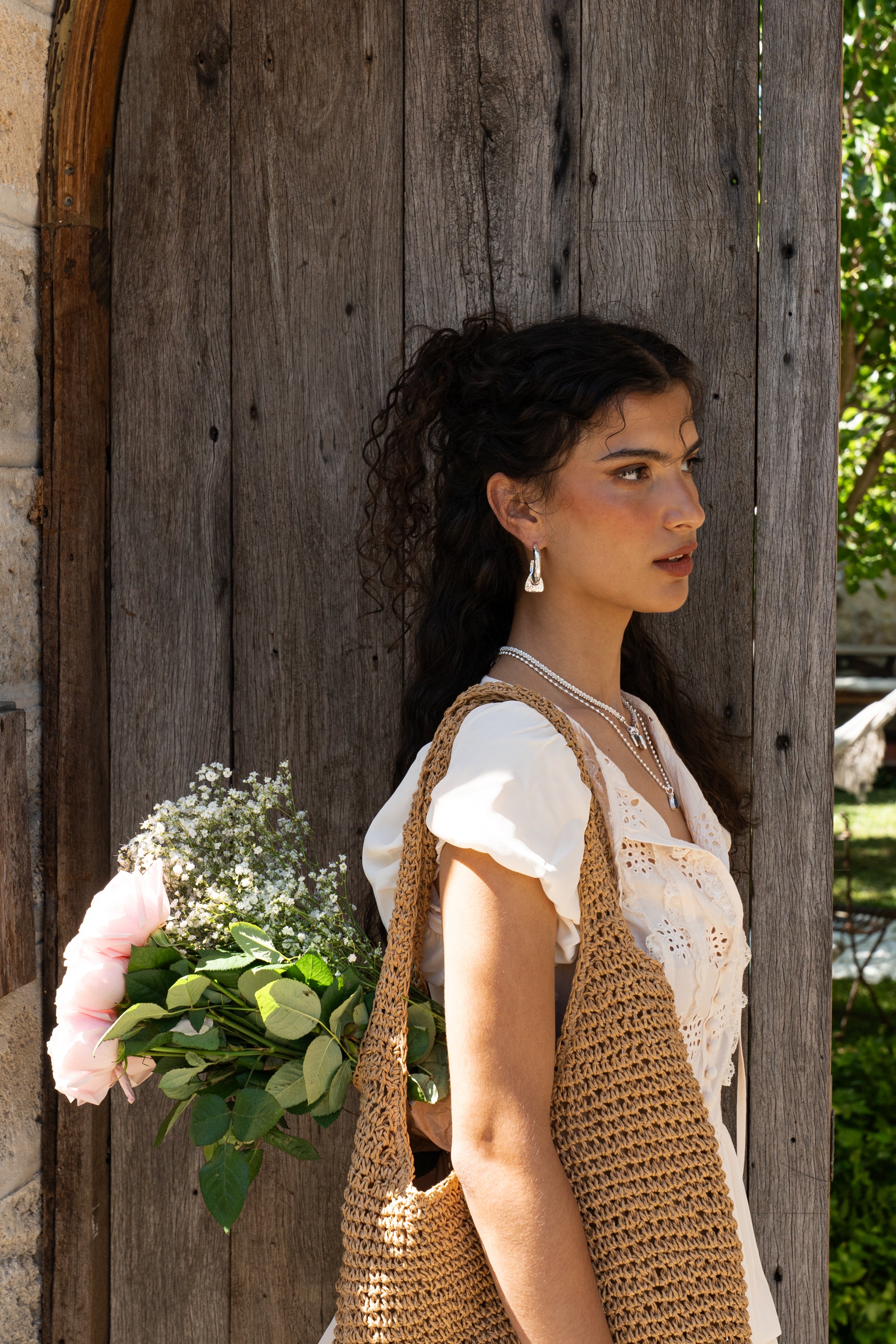 Artemis hammered huggie hoop earrings styled on model, Dalmatian Jasper in silver — Mountain & Moon jewellery