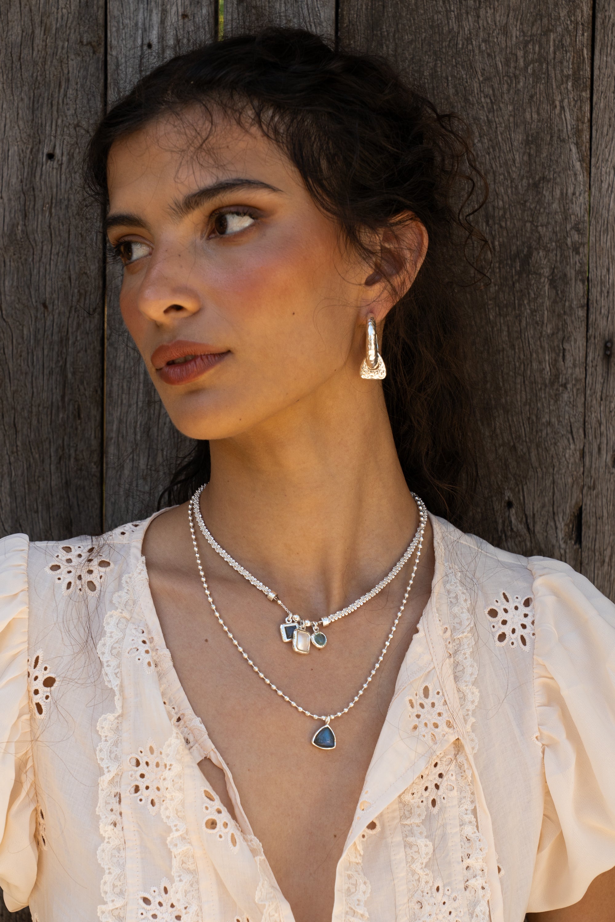 Silver hammered huggie hoop earrings featuring Dalmatian Jasper, the Artemis style — Mountain & Moon Chateau Soleil