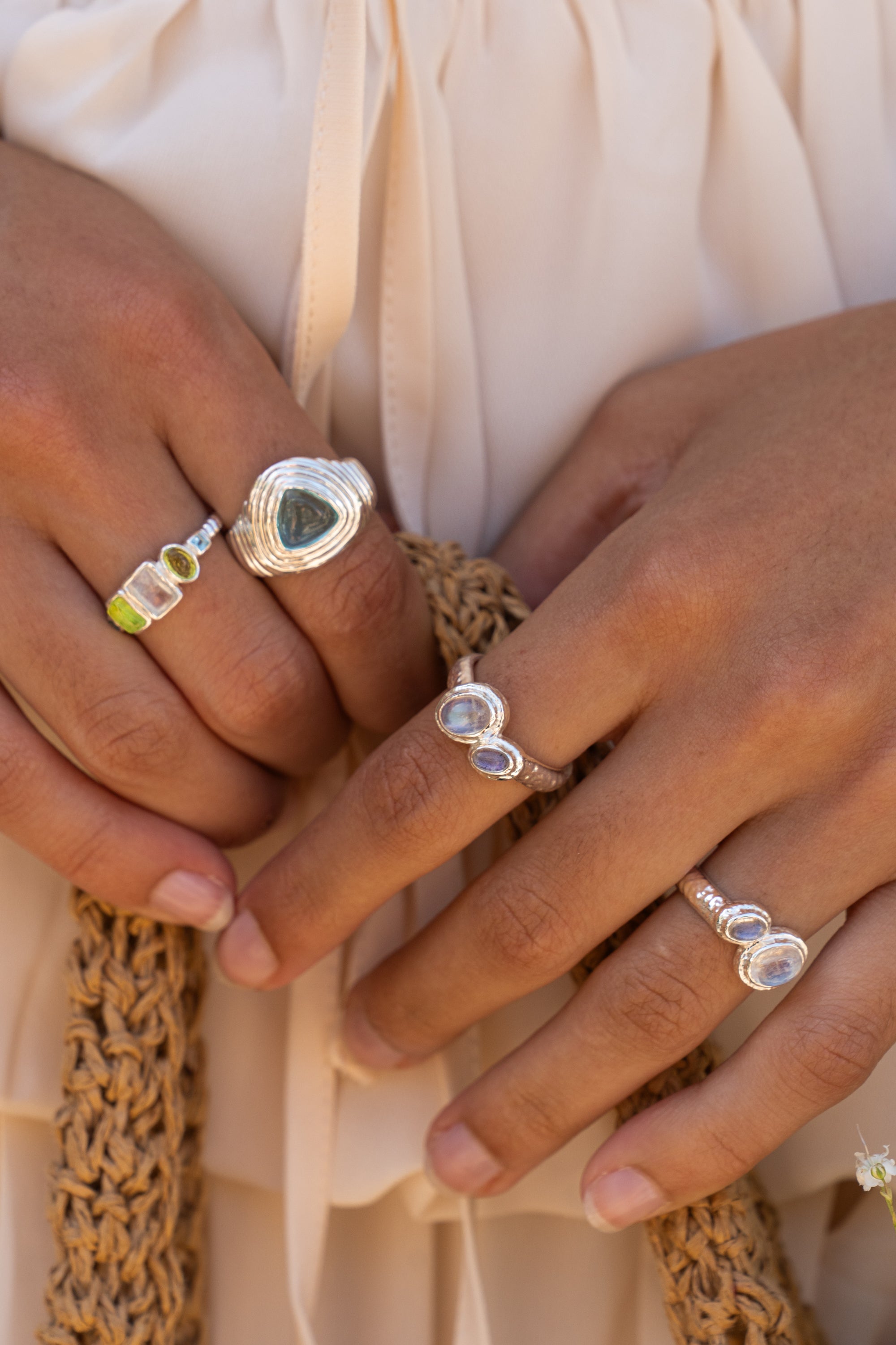 Iris silver cocktail ring with Rainbow Moonstone and Labradorite worn by model — Mountain & Moon Chateau Soleil collection