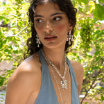 Fleur silver chandelier drop earrings with Glass Blue Topaz worn by model — Mountain & Moon Chateau Soleil collection