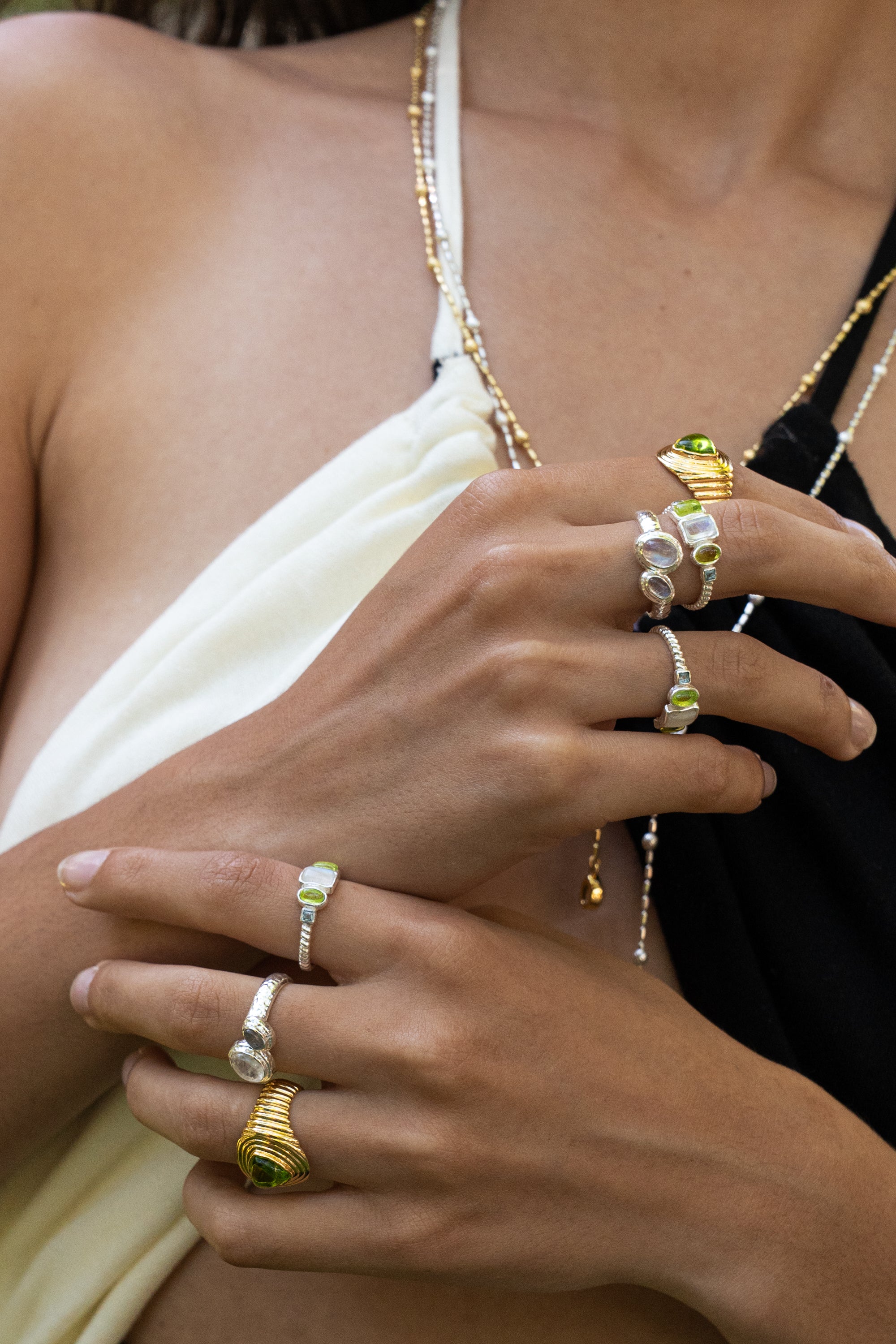 Lumi stacking ring styled on model, Rainbow Moonstone and Glass Peridot in silver — Mountain & Moon jewellery