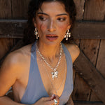Fleur chandelier drop earrings styled on model, Glass Blue Topaz in silver — Mountain & Moon jewellery