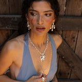 Fleur chandelier drop earrings styled on model, Glass Blue Topaz in silver — Mountain & Moon jewellery