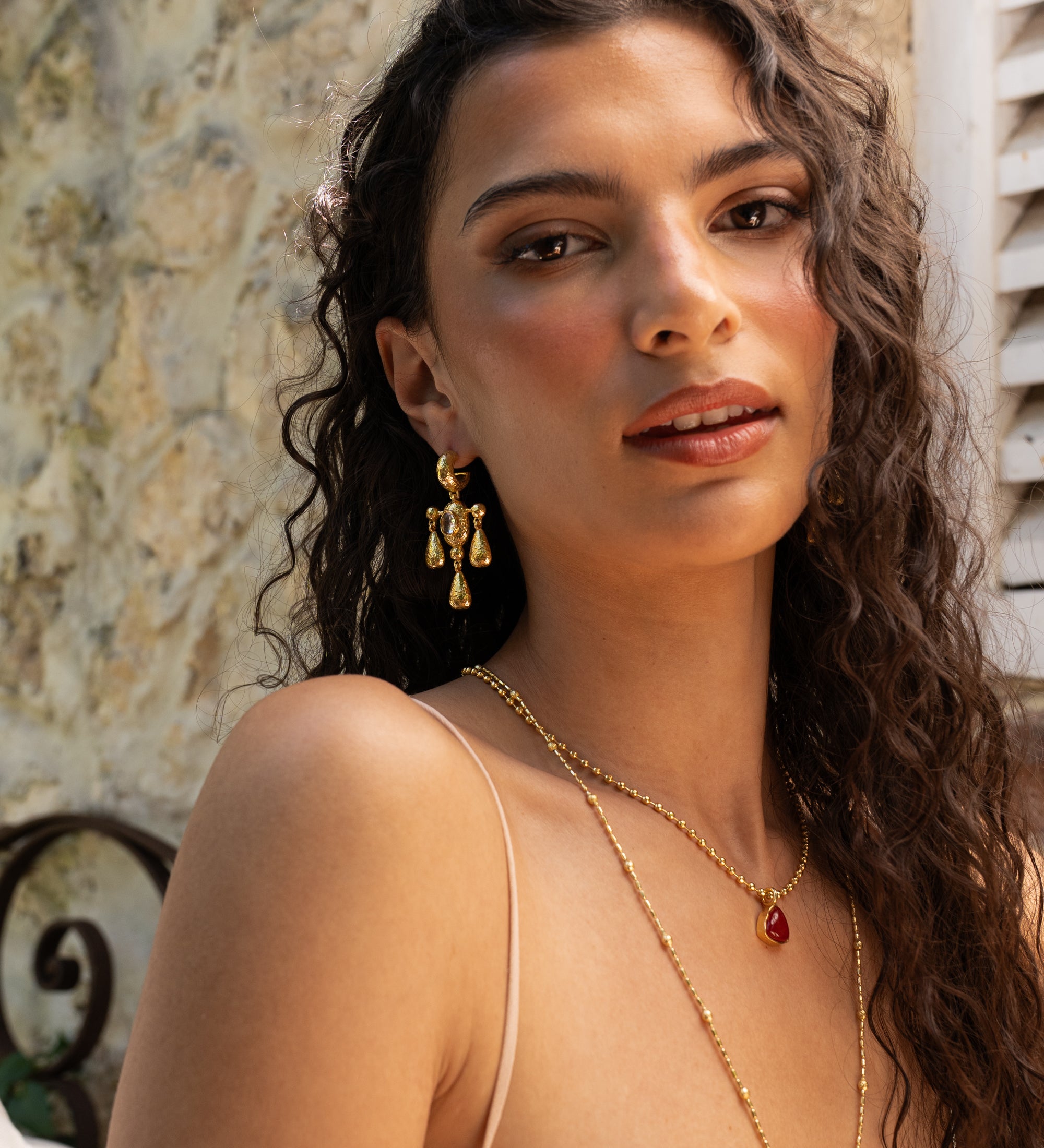 Fleur gold chandelier drop earrings with Crystal Quartz worn by model — Mountain & Moon Chateau Soleil collection