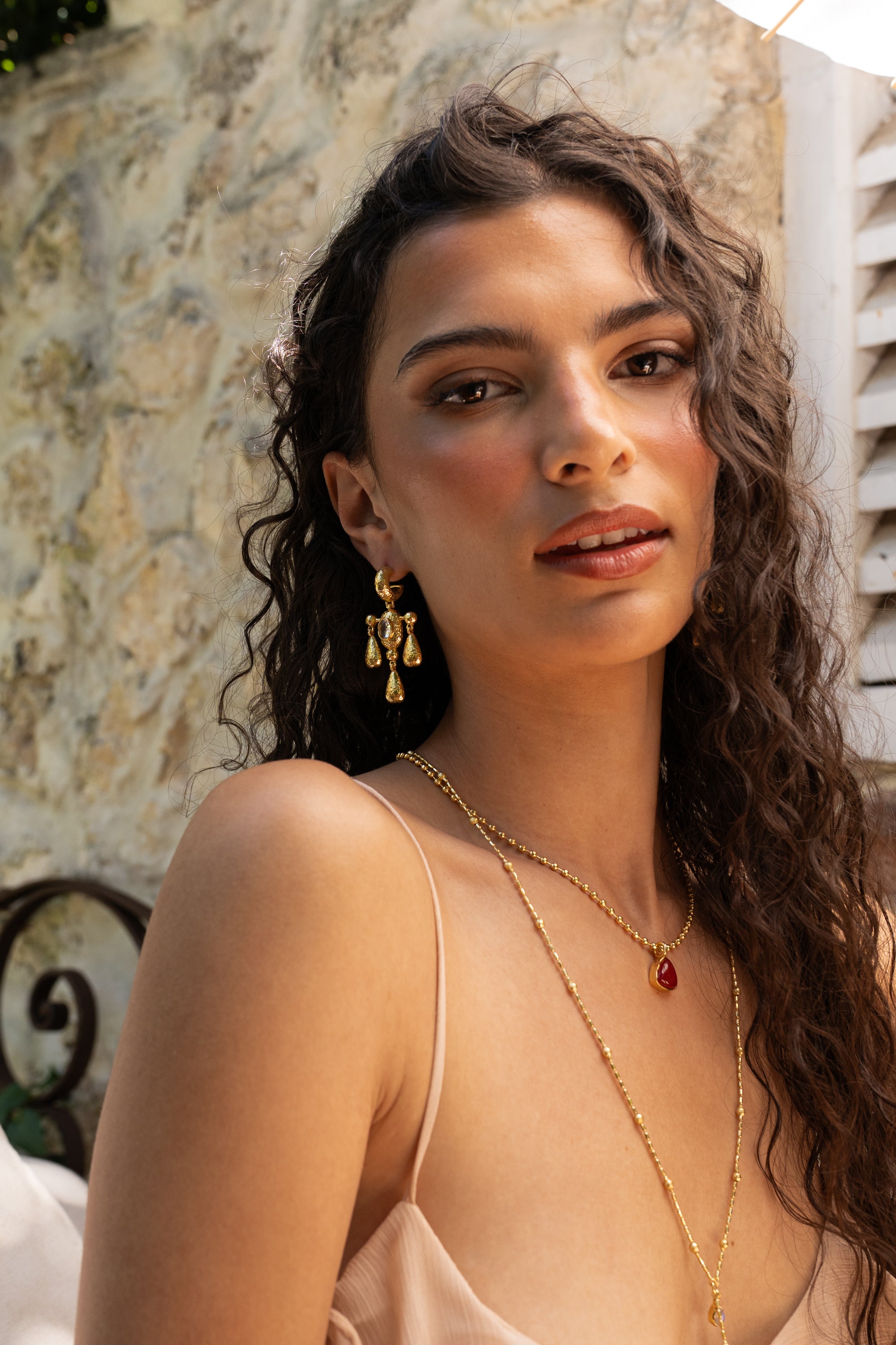 Fleur gold chandelier drop earrings with Crystal Quartz worn by model — Mountain & Moon Chateau Soleil collection