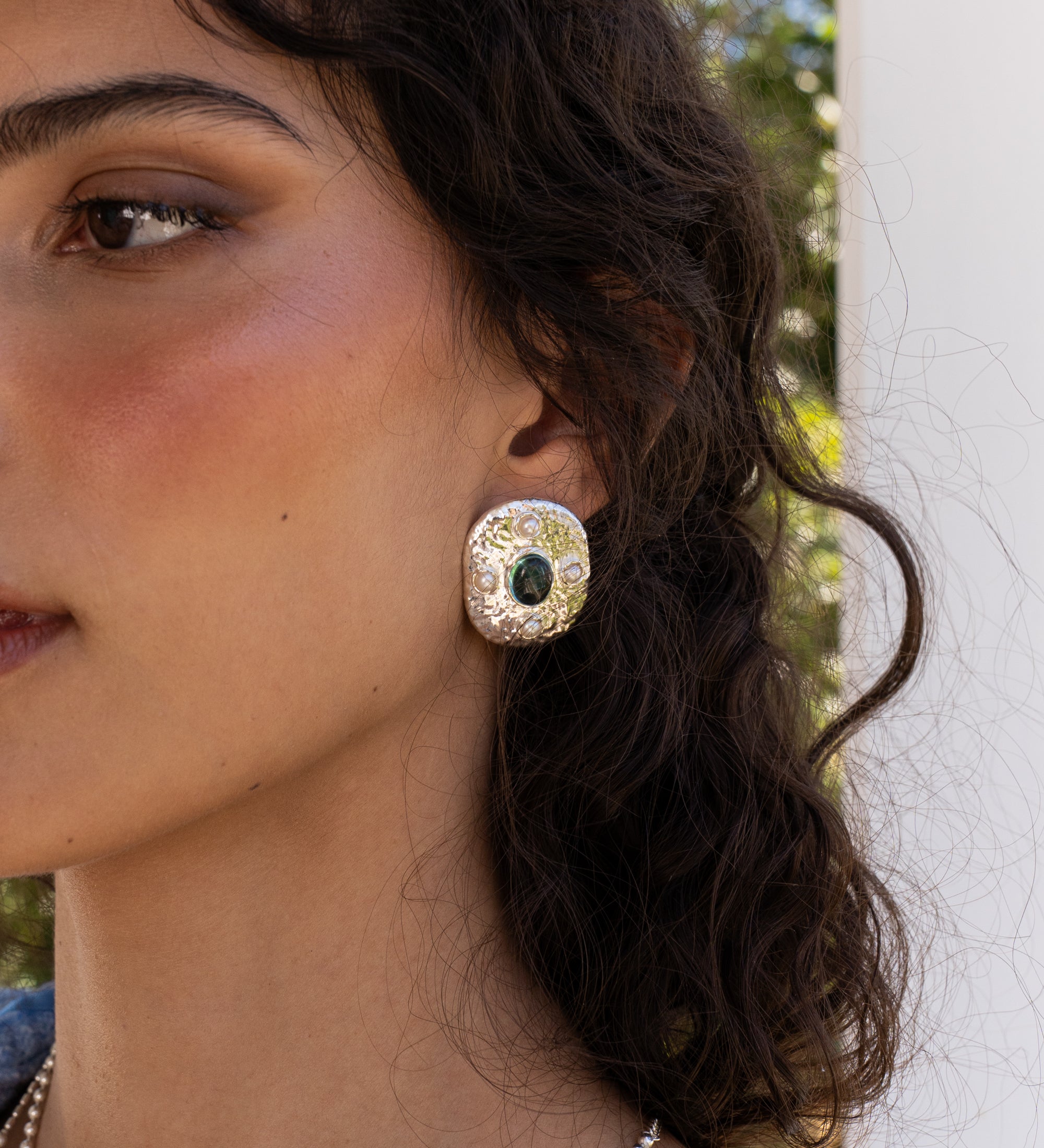 Darcy silver hammered oval stud earrings with Glass Blue Topaz and Freshwater Pearl worn by model — Mountain & Moon Chateau Soleil collection