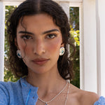 Darcy silver hammered oval stud earrings worn as part of a jewellery stack — Mountain & Moon Chateau Soleil