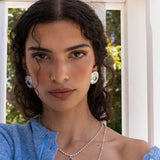 Darcy silver hammered oval stud earrings worn as part of a jewellery stack — Mountain & Moon Chateau Soleil