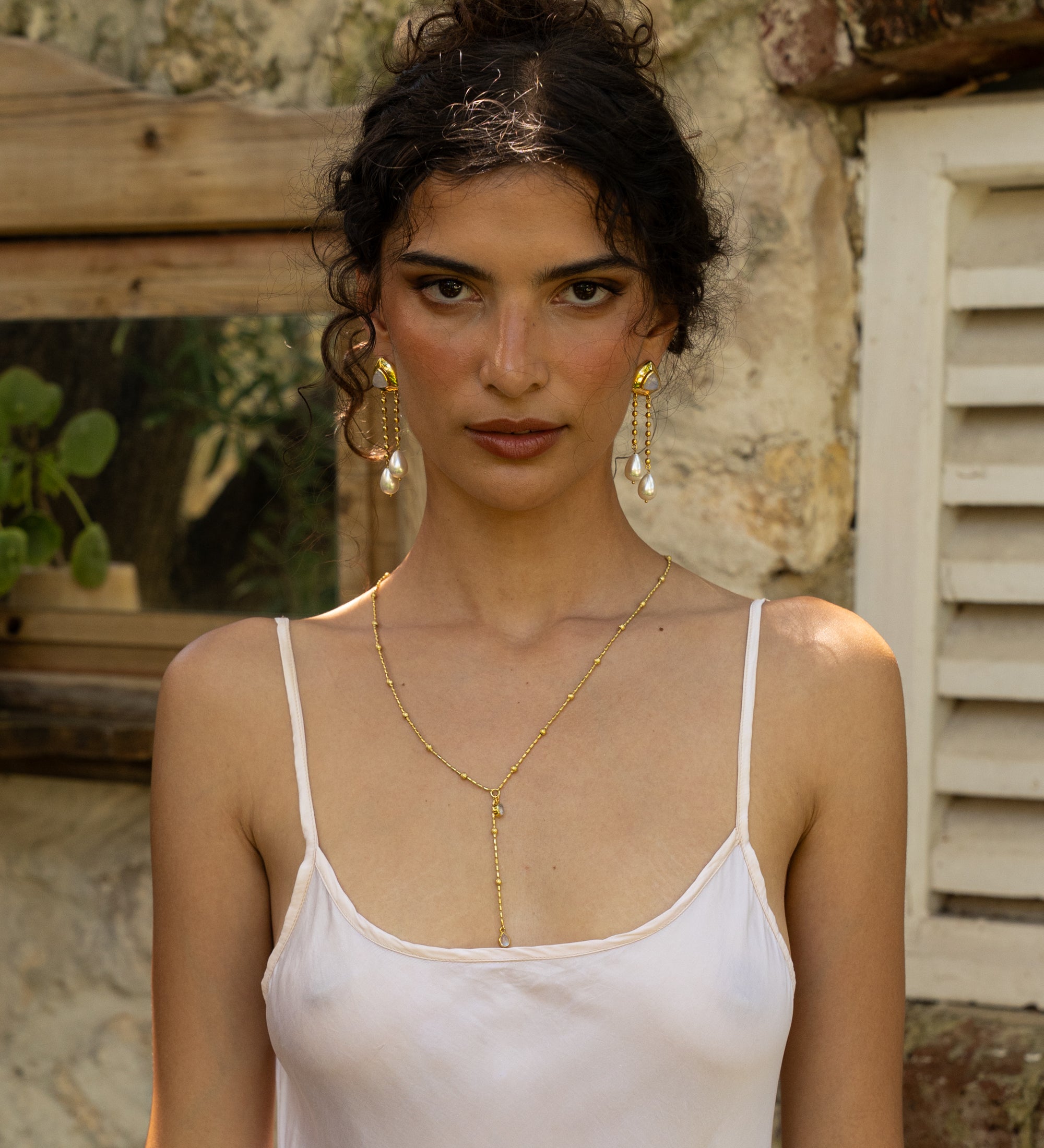 Liberty gold long dangle earrings with Rainbow Moonstone and Glass Pearl worn by model — Mountain & Moon Chateau Soleil collection