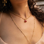 Emery gold pendant necklace with Ruby Quartz worn by model — Mountain & Moon Chateau Soleil collection