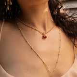 Emery gold pendant necklace with Ruby Quartz worn by model — Mountain & Moon Chateau Soleil collection