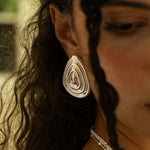Salma silver sculptural teardrop stud earrings worn by model — Mountain & Moon Chateau Soleil collection