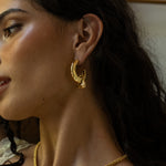 Artemis gold hammered huggie hoop earrings with Tigers Eye worn by model — Mountain & Moon Chateau Soleil collection