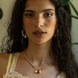 Ruby Quartz, Mother of Pearl and Pink Chalcedony gold charm necklace from the Chateau Soleil collection by Mountain & Moon — Aura