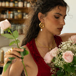 Freya gold swirled hoop earrings with Mother of Pearl worn by model — Mountain & Moon Chateau Soleil collection