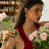 Freya gold swirled hoop earrings with Mother of Pearl worn by model — Mountain & Moon Chateau Soleil collection
