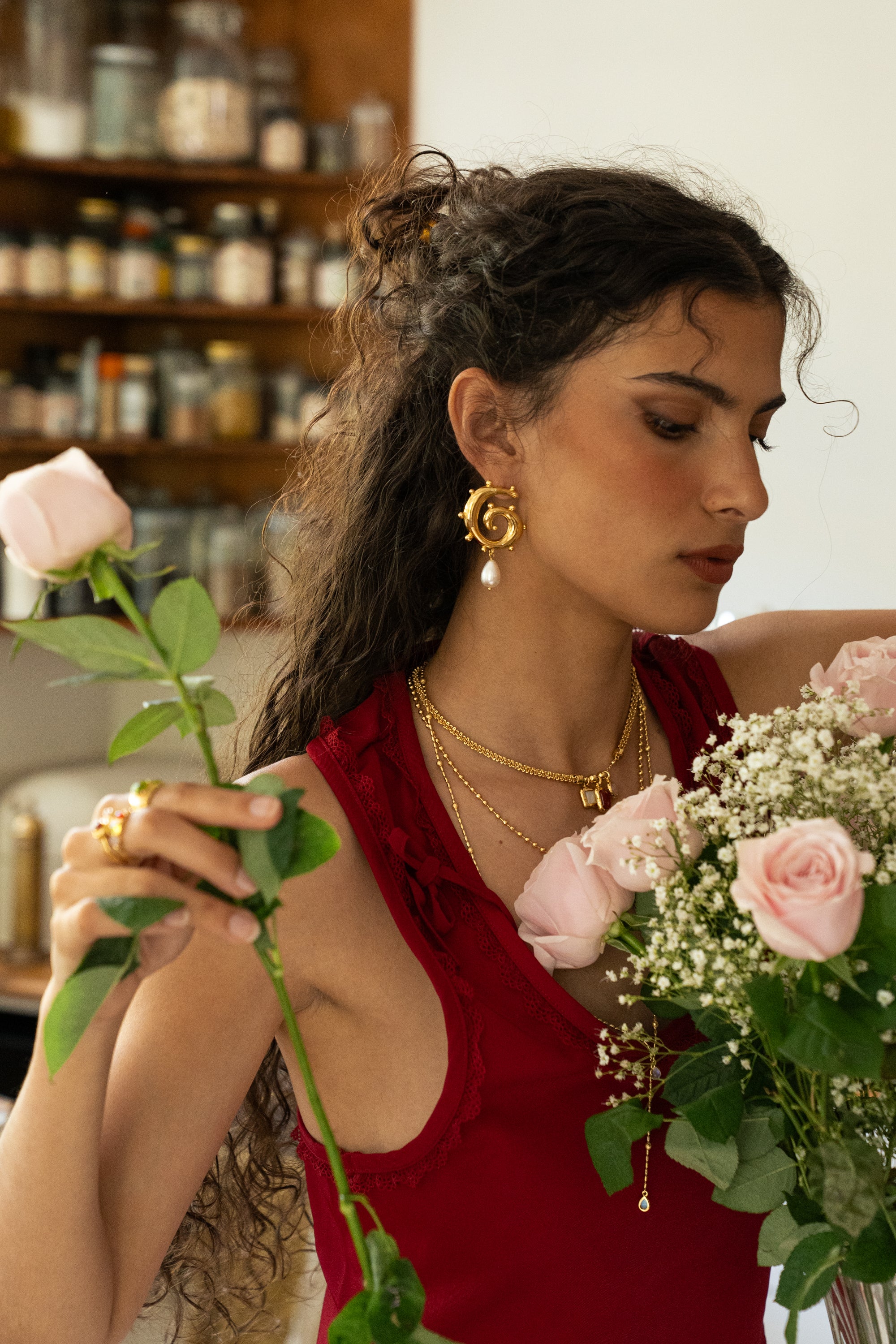 Freya gold swirled hoop earrings with Mother of Pearl worn by model — Mountain & Moon Chateau Soleil collection