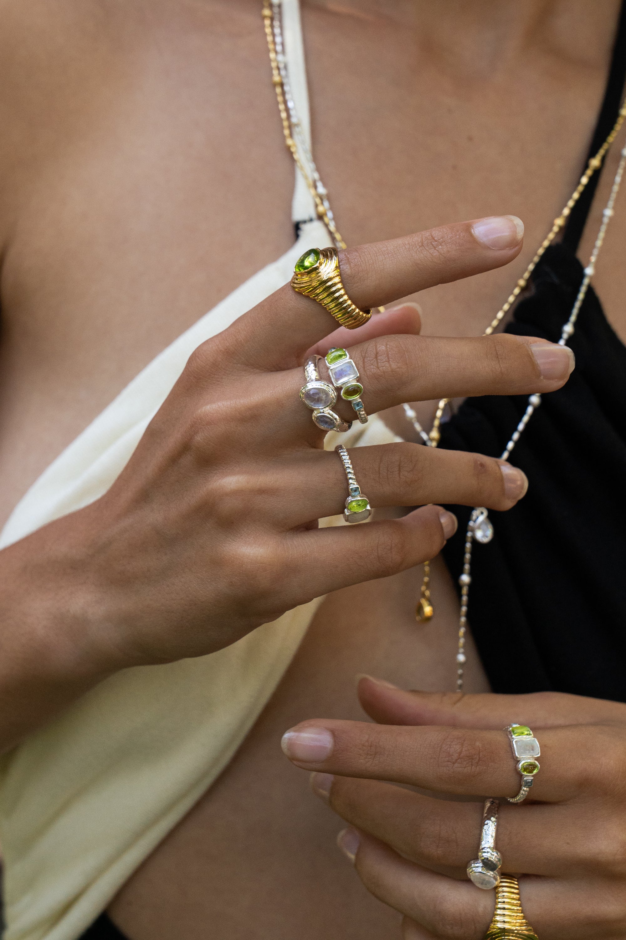 Lumi silver stacking ring with Rainbow Moonstone and Glass Peridot worn by model — Mountain & Moon Chateau Soleil collection