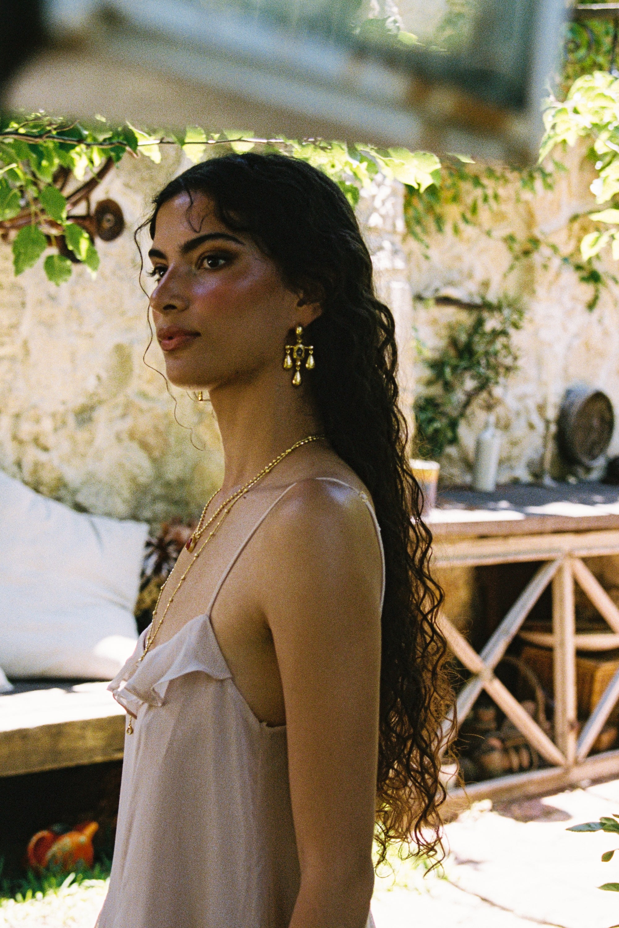 Fleur chandelier drop earrings styled on model, Crystal Quartz in gold — Mountain & Moon jewellery