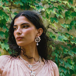 Freya silver swirled hoop earrings with Rainbow Moonstone worn by model — Mountain & Moon Chateau Soleil collection