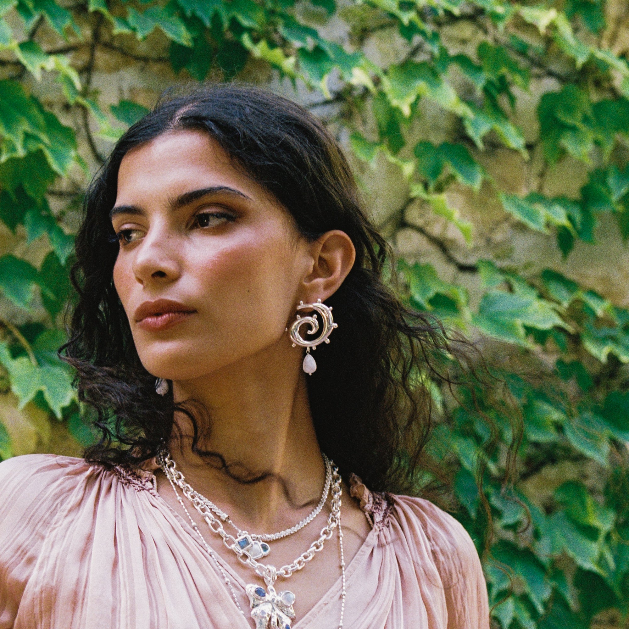 Freya silver swirled hoop earrings with Rainbow Moonstone worn by model — Mountain & Moon Chateau Soleil collection