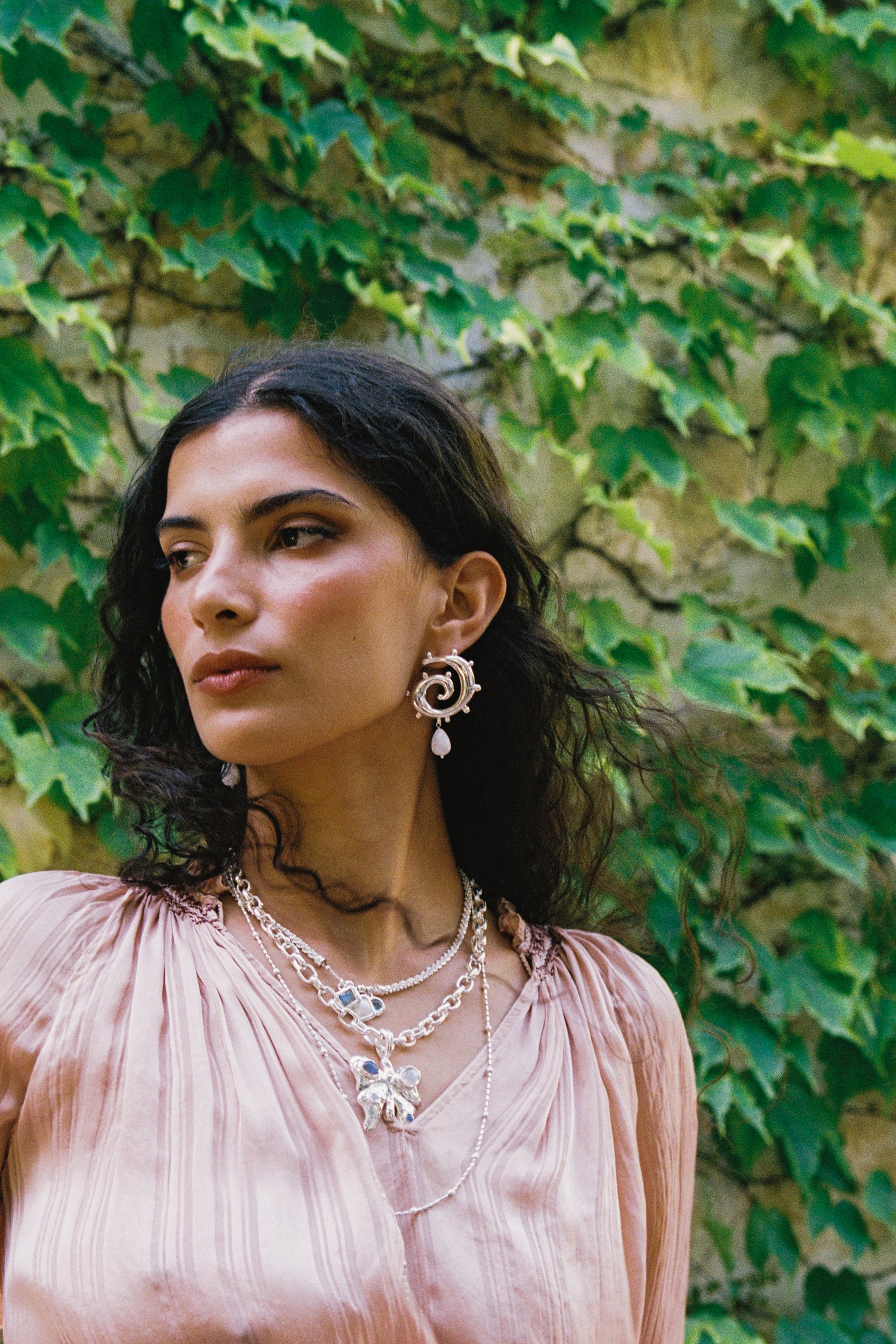Freya silver swirled hoop earrings with Rainbow Moonstone worn by model — Mountain & Moon Chateau Soleil collection