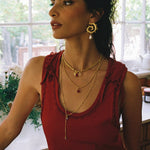 Freya swirled hoop earrings styled on model, Mother of Pearl in gold — Mountain & Moon jewellery