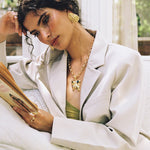 Salma gold sculptural teardrop stud earrings worn by model — Mountain & Moon Chateau Soleil collection